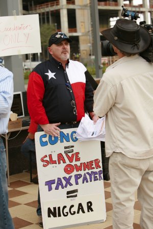 tea party leader caught with racist sign